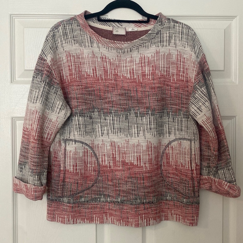 Red / black / cream abstract print sweatshirt top from Anthropologie.